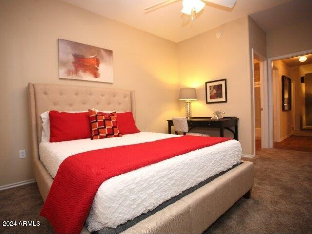 411 East Indian School Road, Unit 21 Phoenix, AZ 85012 - Photo 8 of 16 a bedroom with a bed and a painting on the wall