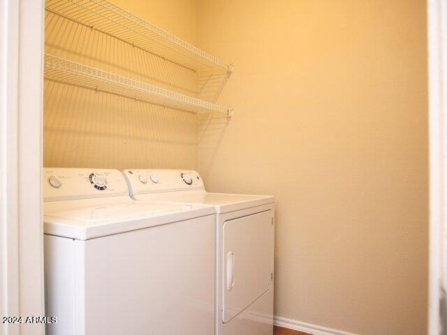 411 East Indian School Road, Unit 21 Phoenix, AZ 85012 - Photo 10 of 16 a utility room with dryer and washer