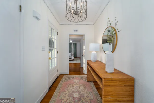 a view of hallway with a mirror and a window