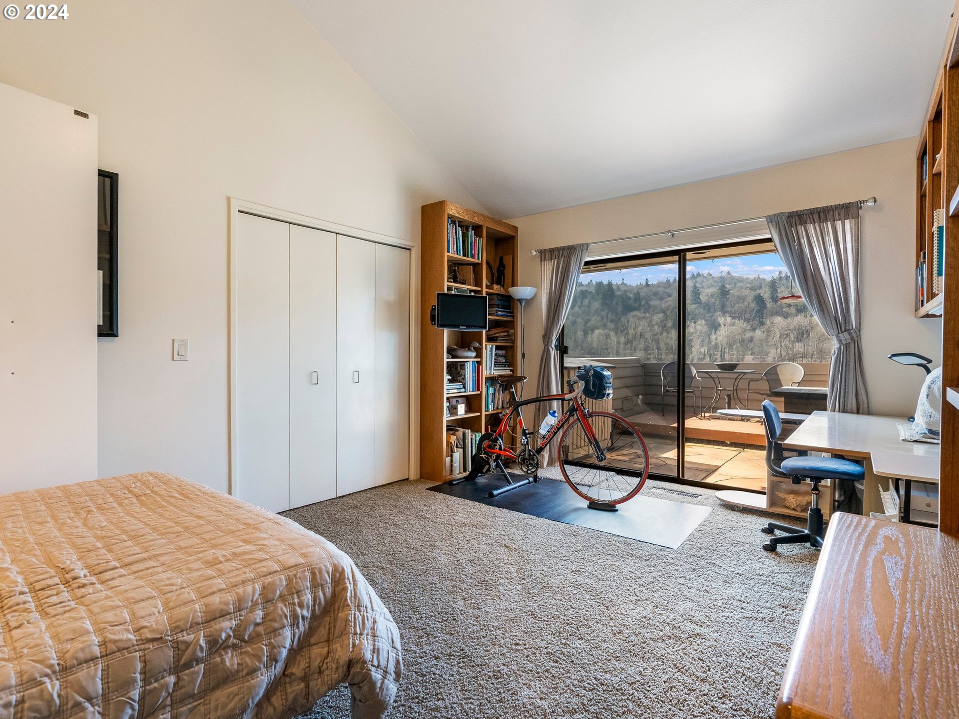 222 Southeast Spokane Street, Unit 3 Portland, OR 97202 - Photo 15 of 47 a bedroom with a bed and large windows