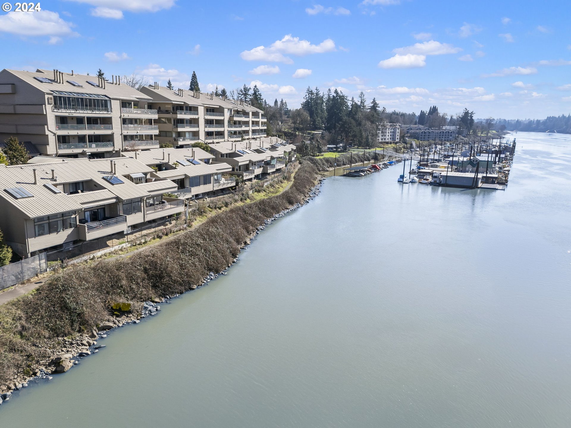 222 Southeast Spokane Street, Unit 3 Portland, OR 97202 - Photo 2 of 47 a view of a lake with outdoor space