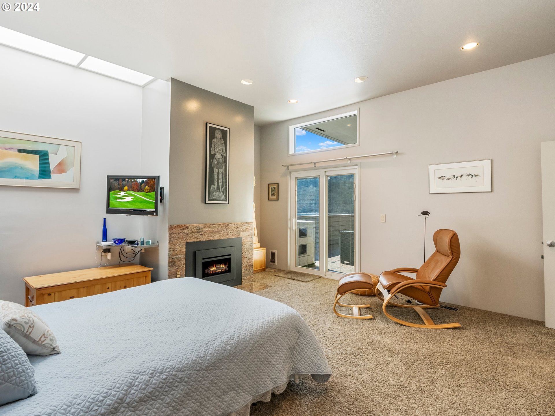 222 Southeast Spokane Street, Unit 3 Portland, OR 97202 - Photo 21 of 47 a bedroom with furniture and a fireplace