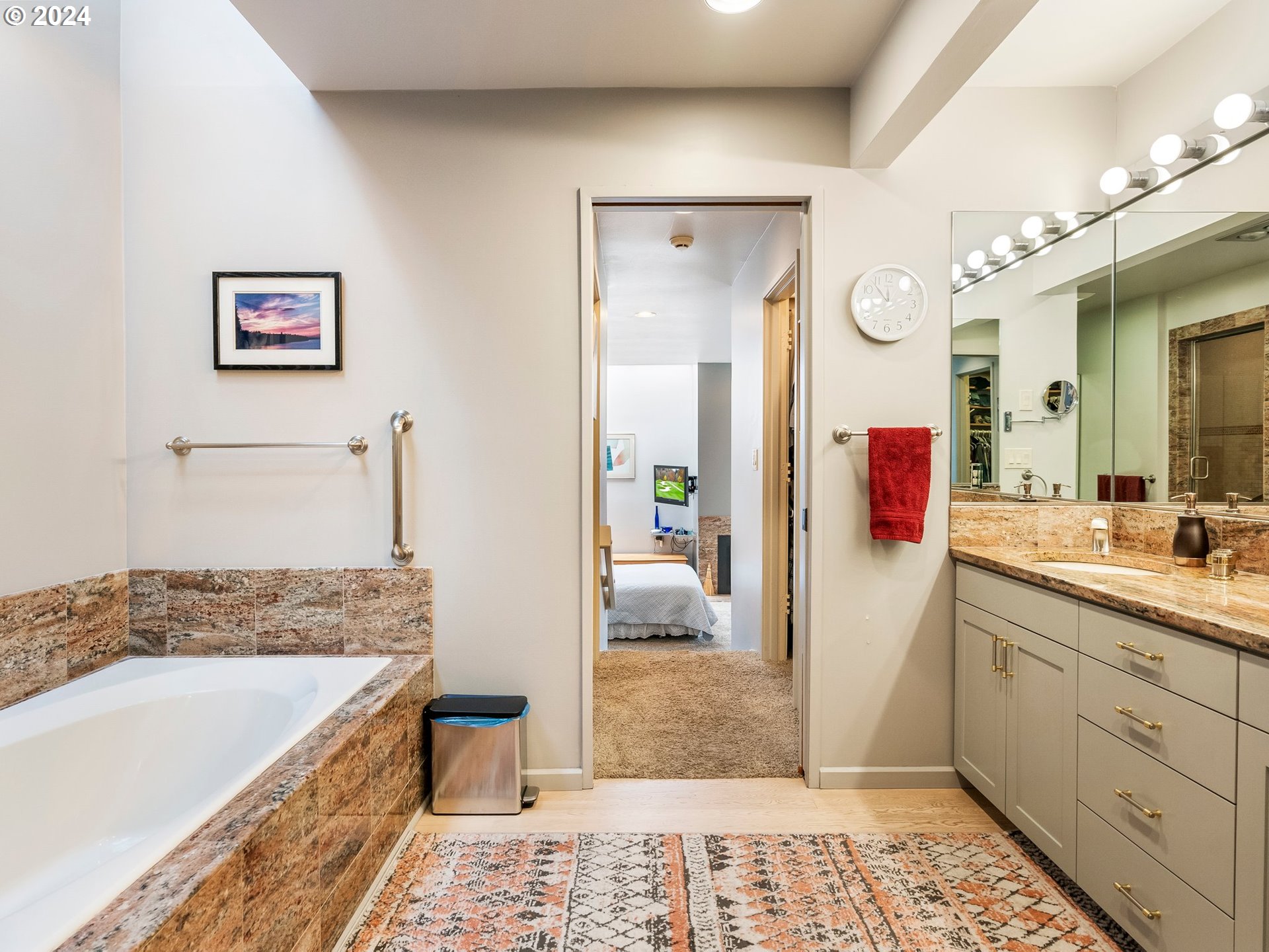 222 Southeast Spokane Street, Unit 3 Portland, OR 97202 - Photo 24 of 47 a bathroom with a tub sink and mirror