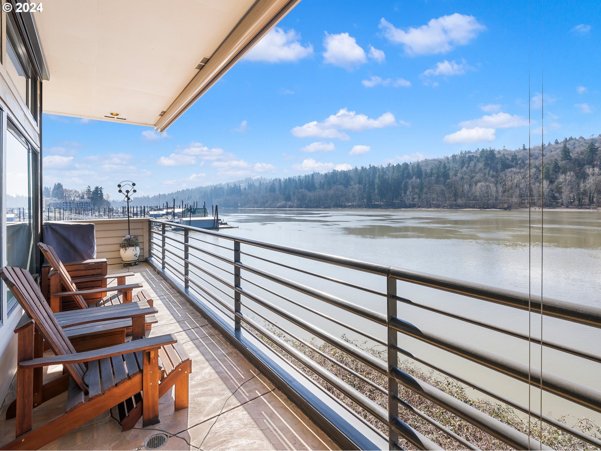 222 Southeast Spokane Street, Unit 3 Portland, OR 97202 - Photo 27 of 47 a view of a terrace with wooden floor and a floor to ceiling window