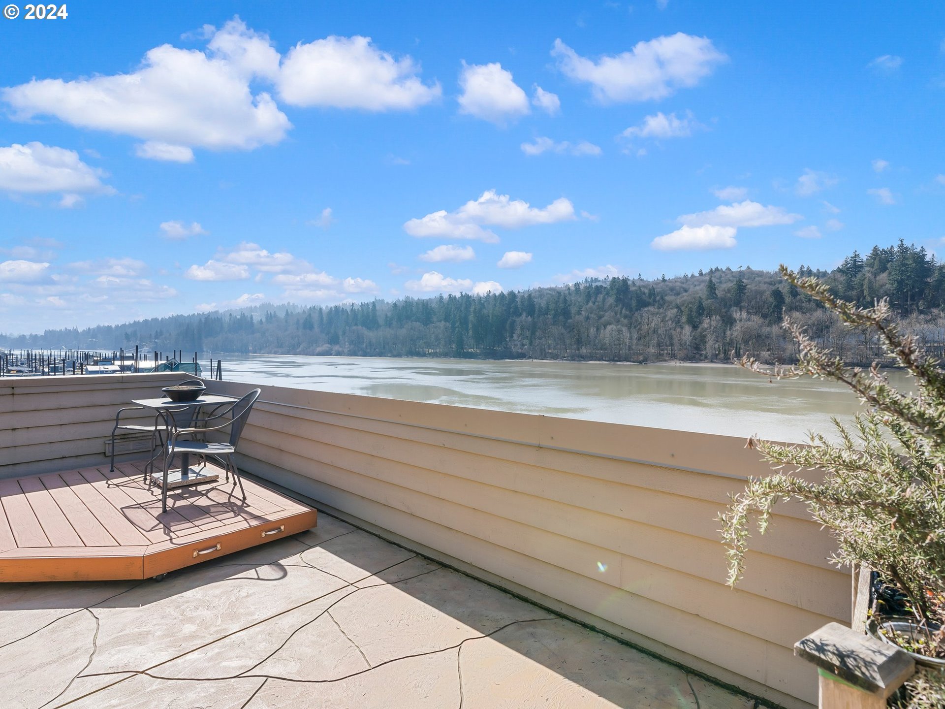 222 Southeast Spokane Street, Unit 3 Portland, OR 97202 - Photo 36 of 47 a view of a lake with couches and city view