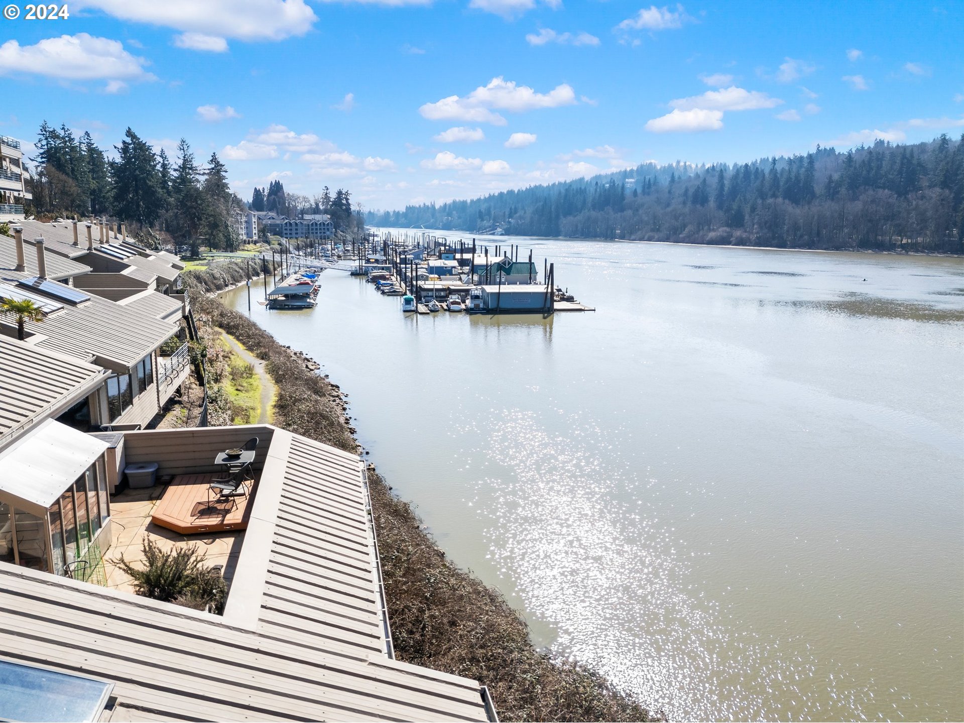 222 Southeast Spokane Street, Unit 3 Portland, OR 97202 - Photo 40 of 47 a view of a terrace with wooden floor and lake view