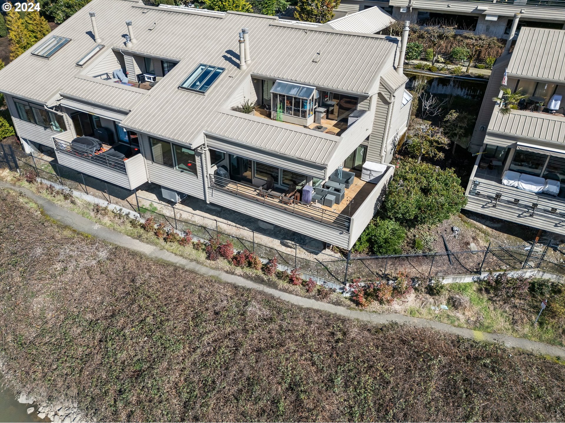 222 Southeast Spokane Street, Unit 3 Portland, OR 97202 - Photo 5 of 47 an aerial view of a house with a yard
