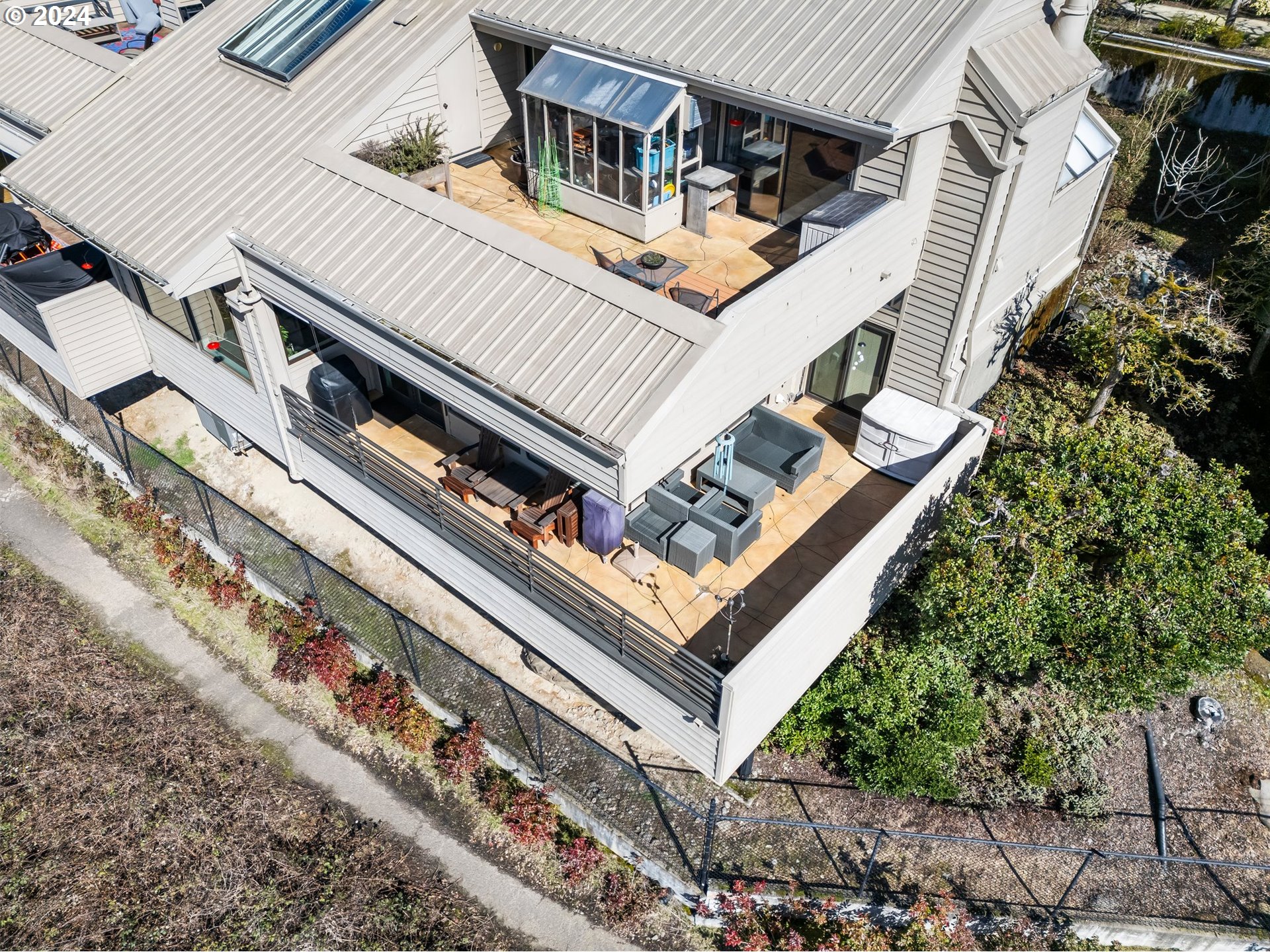 222 Southeast Spokane Street, Unit 3 Portland, OR 97202 - Photo 6 of 47 a view of a house with a trees