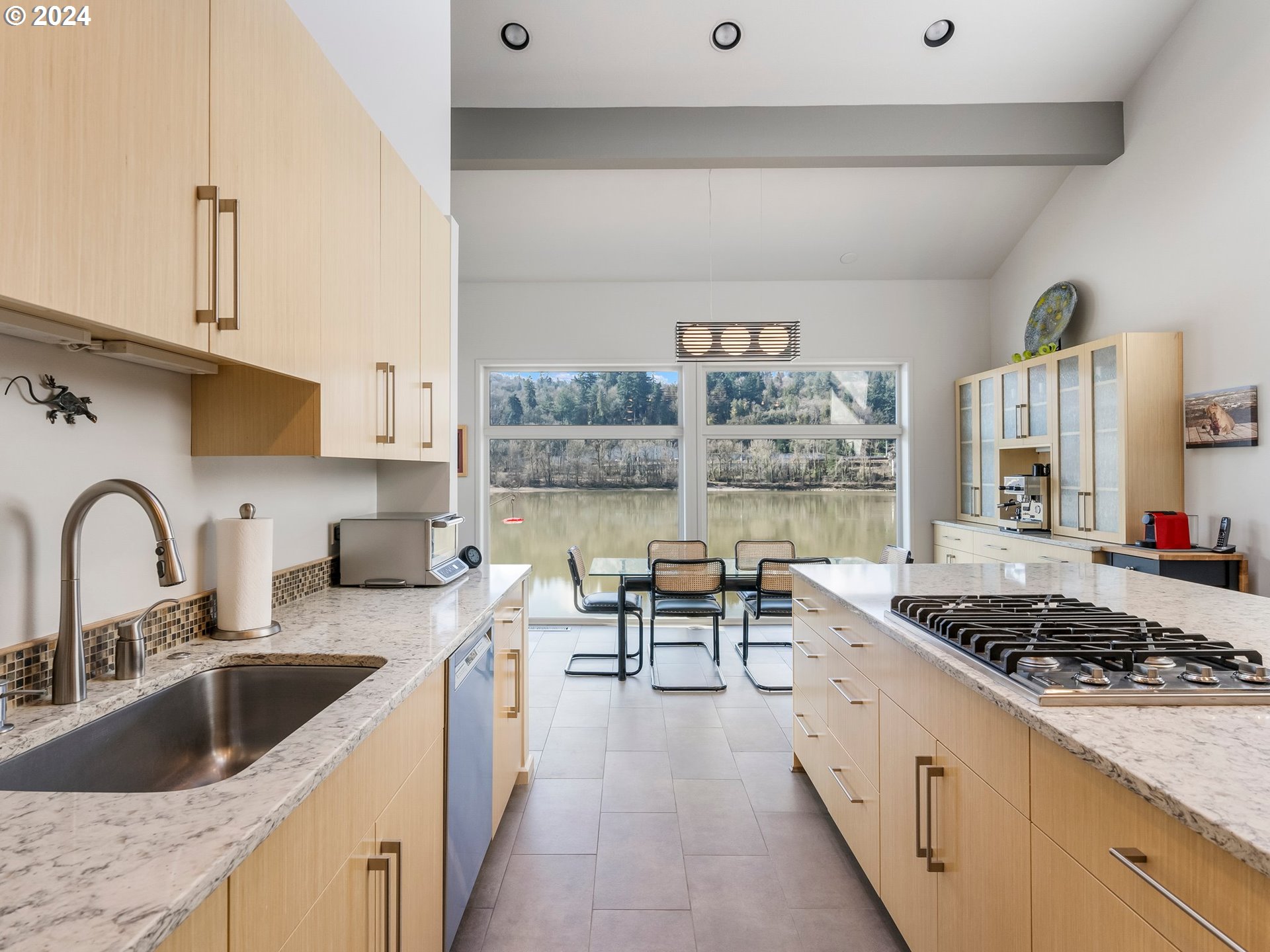222 Southeast Spokane Street, Unit 3 Portland, OR 97202 - Photo 9 of 47 a kitchen with stainless steel appliances granite countertop a sink stove and cabinets