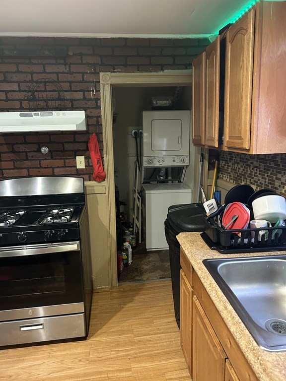61 Forest Street Boston, MA 02119 - Photo 9 of 36 a kitchen with a stove and a microwave