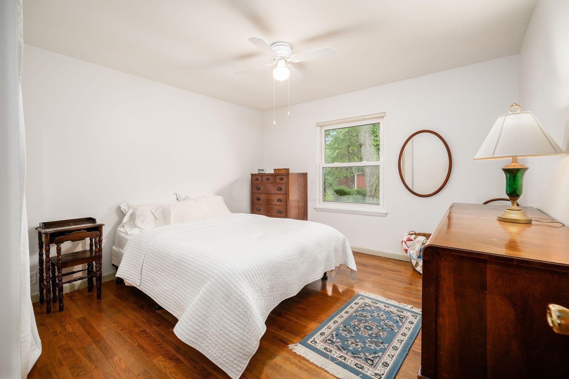 350 Jefferson Road Newark, OH 43055 - Photo 15 of 38 Bedroom with hardwood flooring and a fan/light combo.