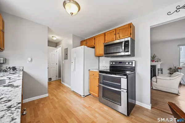 a kitchen with stainless steel appliances a stove microwave and a refrigerator