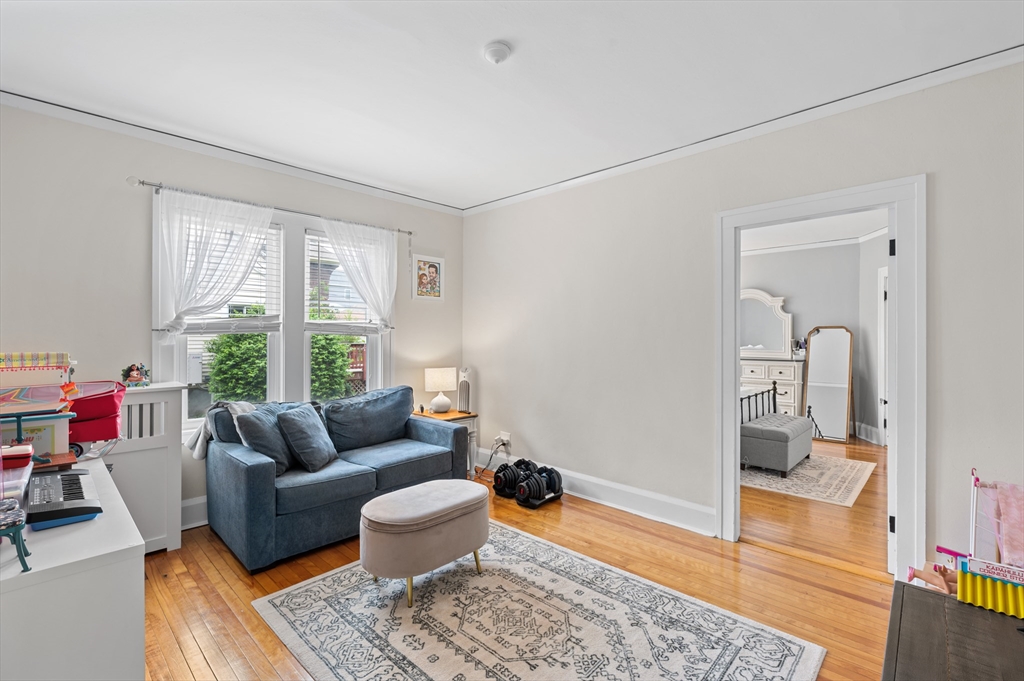 23 Devens Road Worcester, MA 01606 - Photo 12 of 42 a living room with furniture and a window