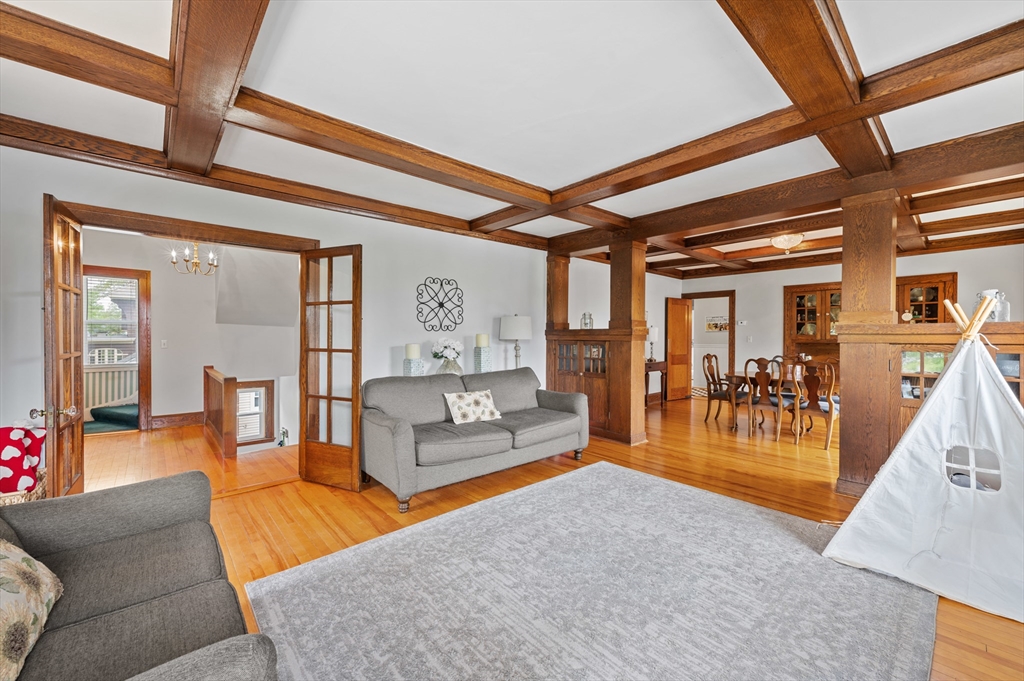 23 Devens Road Worcester, MA 01606 - Photo 21 of 42 a living room with furniture a dining table and a large window