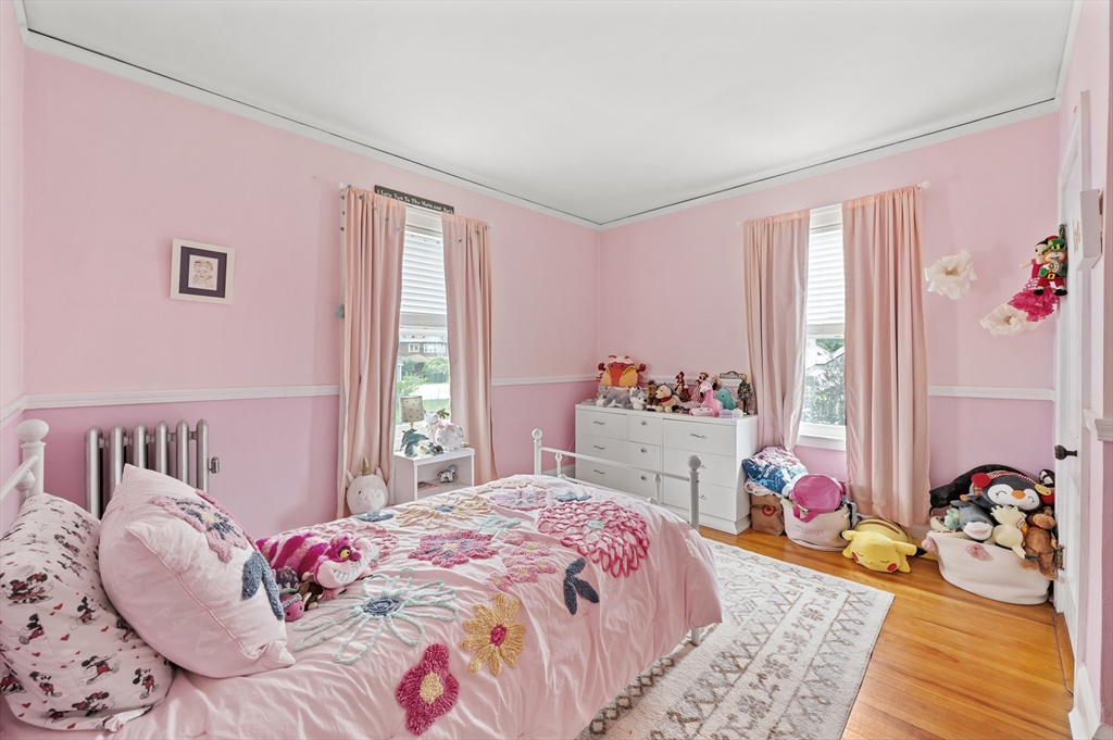 23 Devens Road Worcester, MA 01606 - Photo 27 of 42 a bedroom with a bed and a window