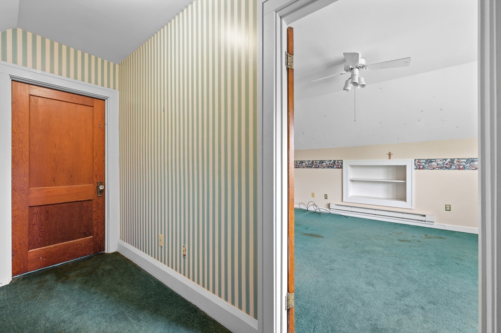 23 Devens Road Worcester, MA 01606 - Photo 34 of 42 an empty room with an entryway and a cabinet