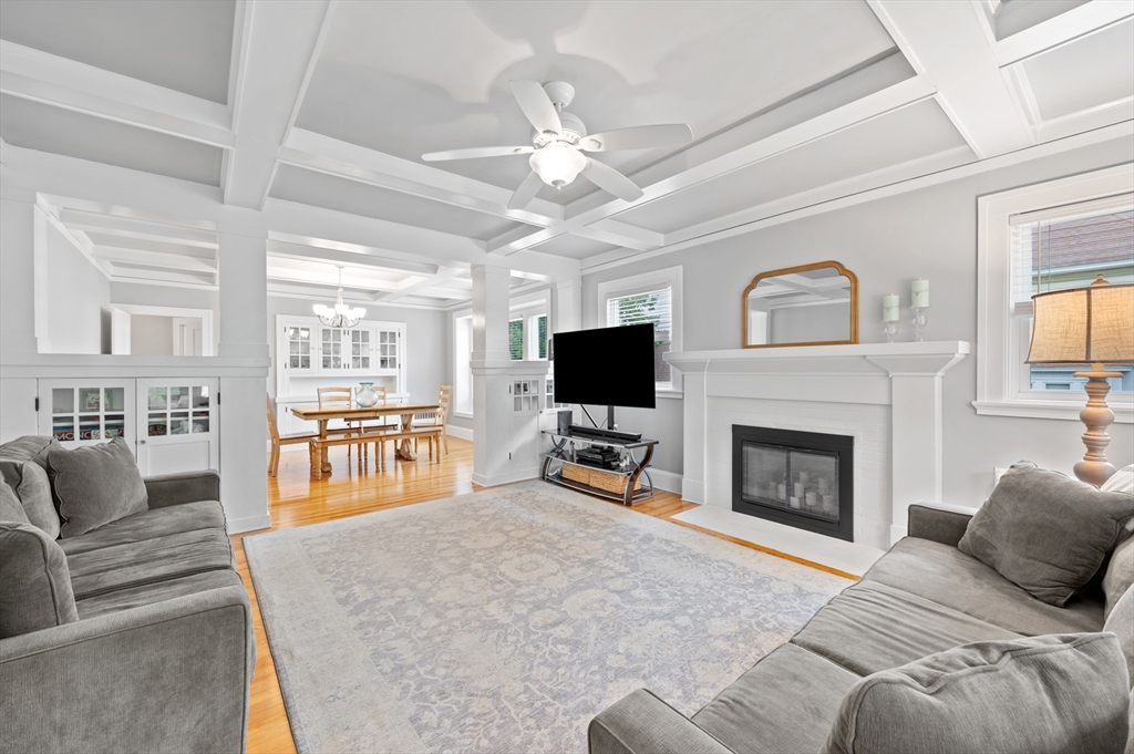 23 Devens Road Worcester, MA 01606 - Photo 7 of 42 a living room with furniture a flat screen tv and a fireplace
