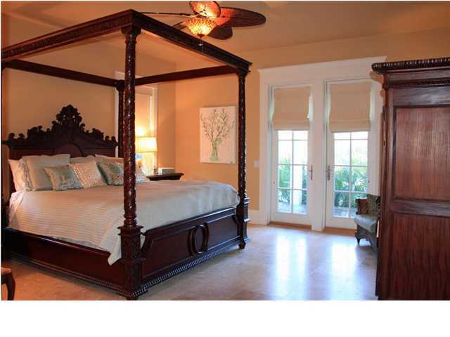 42 Founders Lane Watersound, FL 32461 - Photo 13 of 33 a living room with a bed furniture and a window