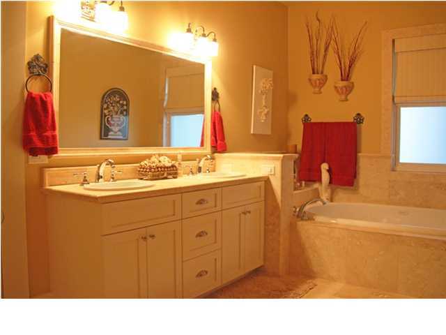 42 Founders Lane Watersound, FL 32461 - Photo 14 of 33 a bathroom with a sink and a mirror