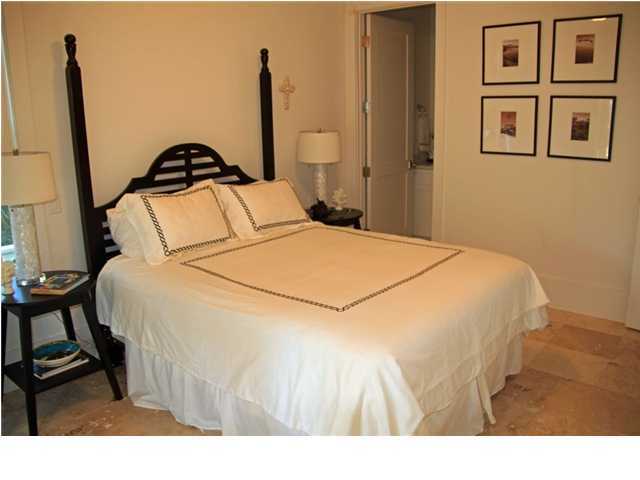 42 Founders Lane Watersound, FL 32461 - Photo 15 of 33 a bedroom with a bed and a painting on the wall