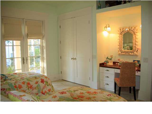 42 Founders Lane Watersound, FL 32461 - Photo 17 of 33 a room with a bed and a dresser