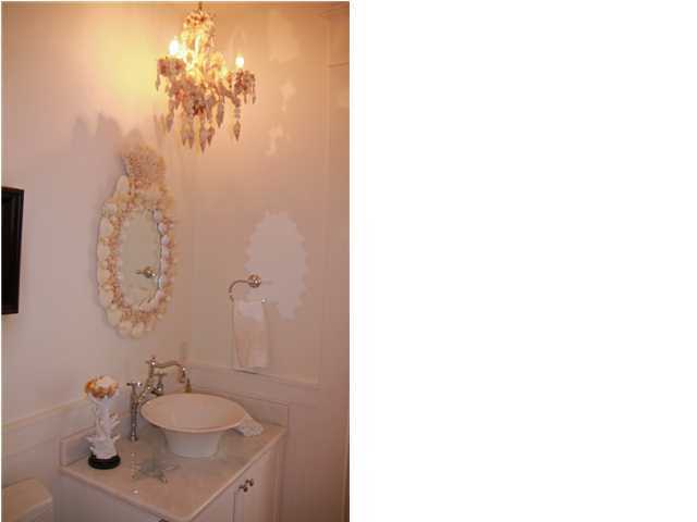 42 Founders Lane Watersound, FL 32461 - Photo 20 of 33 a bathroom with a sink and a mirror