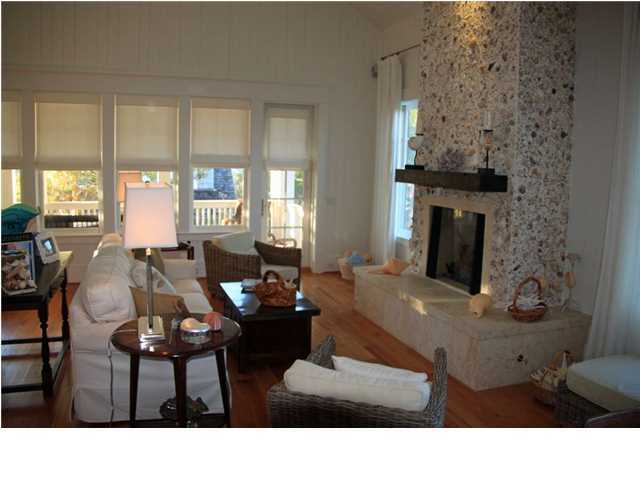 42 Founders Lane Watersound, FL 32461 - Photo 2 of 33 a living room with furniture and a fireplace
