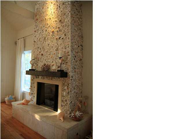 42 Founders Lane Watersound, FL 32461 - Photo 3 of 33 a living room with a fireplace