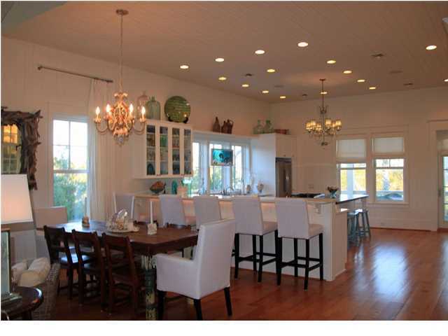 42 Founders Lane Watersound, FL 32461 - Photo 8 of 33 a view of a dining room with furniture and wooden floor