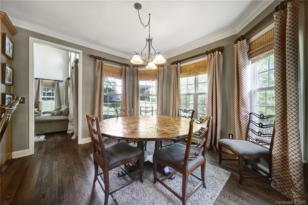 305 Golfview Crest Tega Cay, SC 29708 - Photo 14 of 48 a view of a dining room with furniture window and wooden floor