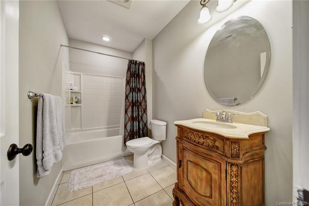 305 Golfview Crest Tega Cay, SC 29708 - Photo 40 of 48 a bathroom with a sink toilet and shower