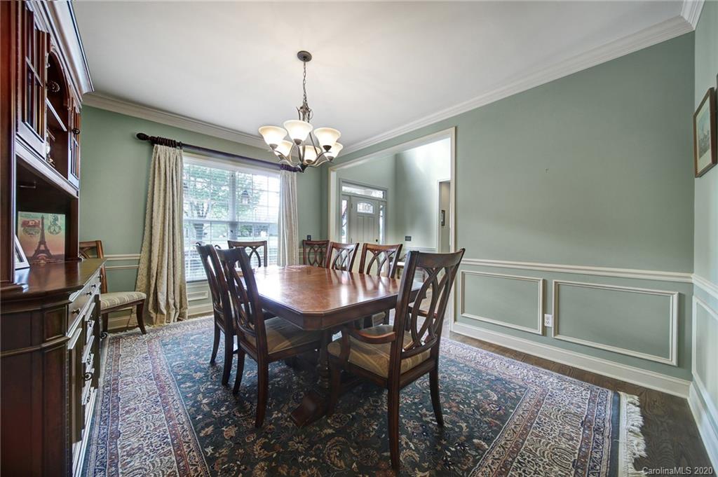 305 Golfview Crest Tega Cay, SC 29708 - Photo 8 of 48 a view of a dining room with furniture and chandelier