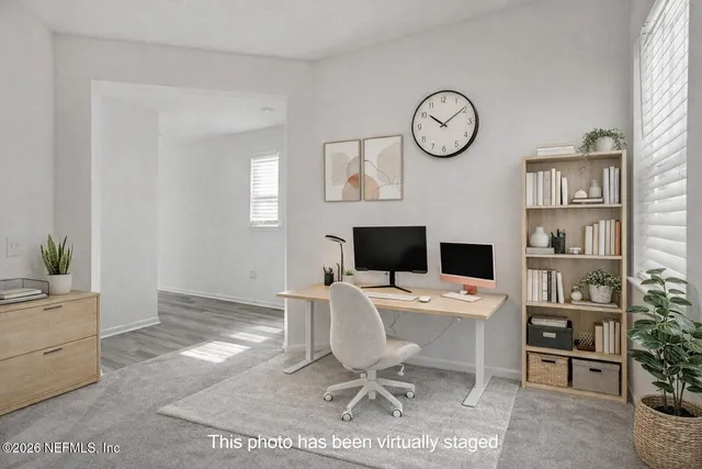 a view of a room with a baby crib and a window