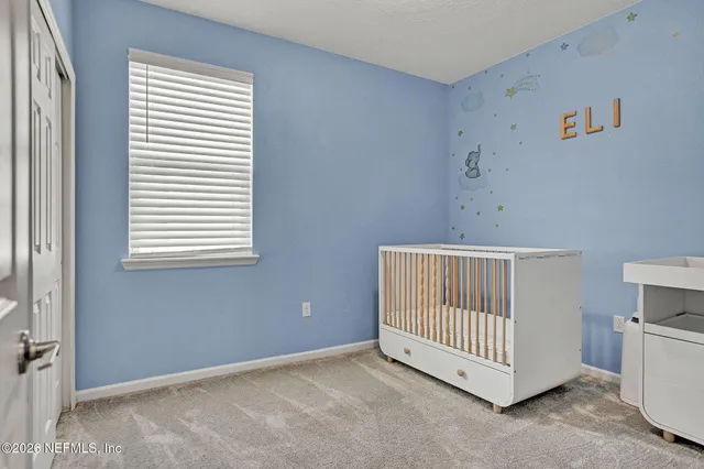 a bathroom with a sink toilet a mirror and shower