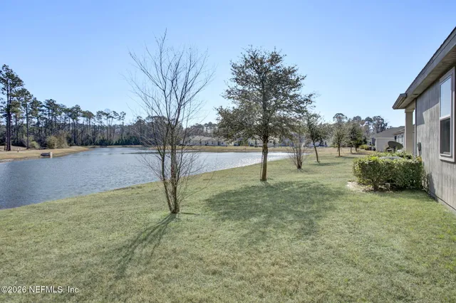 a house that has a tree in front of the house