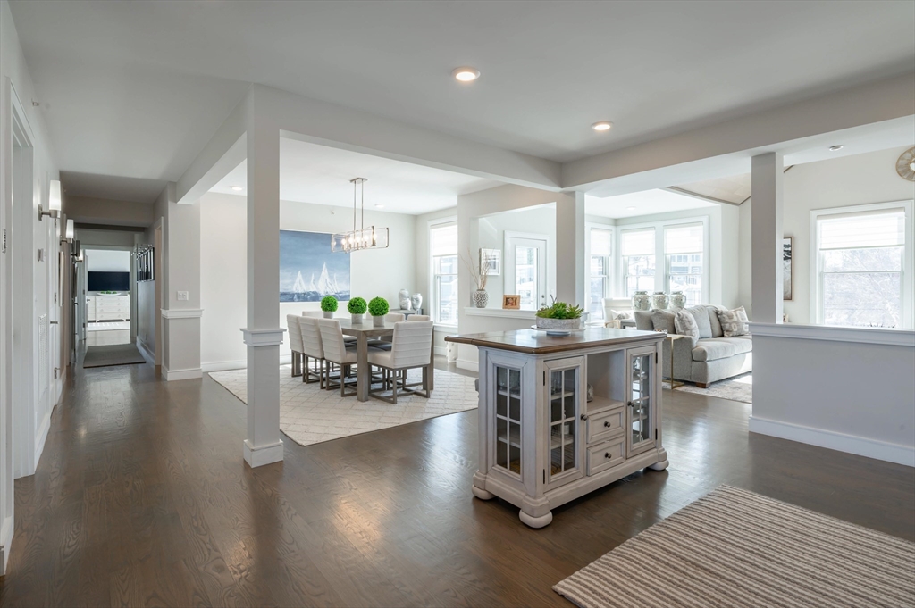 78 Thatcher Road, Unit 6 Gloucester, MA 01930 - Photo 12 of 41 a kitchen with stainless steel appliances white cabinets and wooden floor