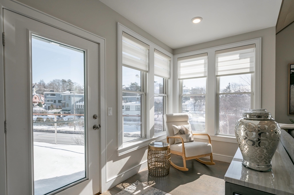 78 Thatcher Road, Unit 6 Gloucester, MA 01930 - Photo 15 of 41 a living room with furniture and floor to ceiling windows