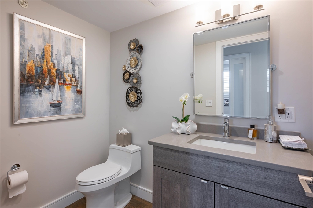 78 Thatcher Road, Unit 6 Gloucester, MA 01930 - Photo 16 of 41 a bathroom with a toilet a sink and mirror