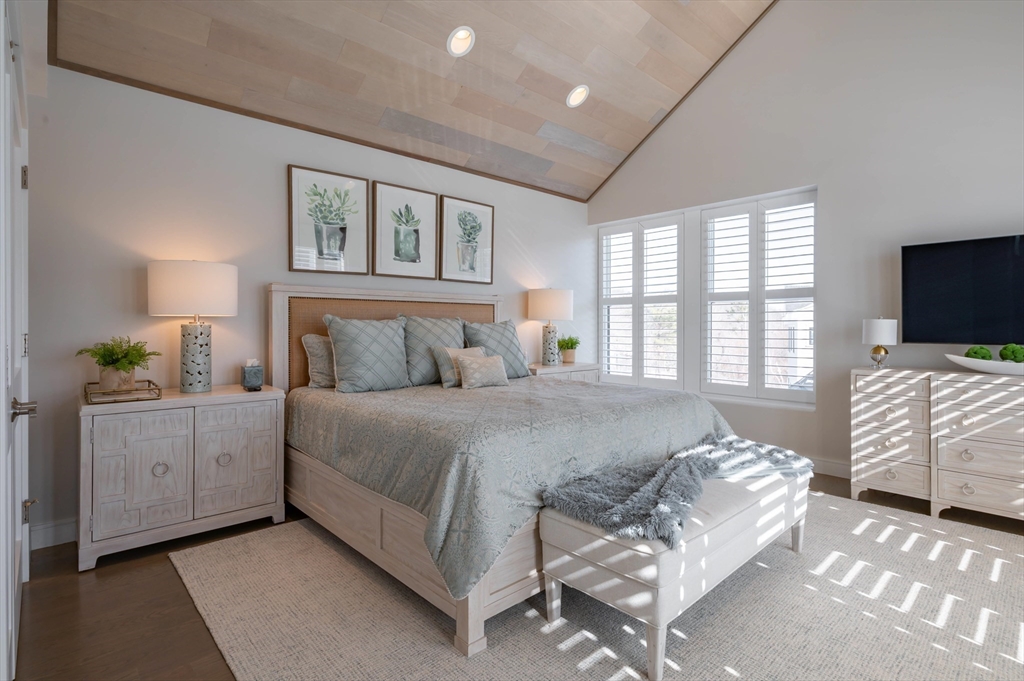 78 Thatcher Road, Unit 6 Gloucester, MA 01930 - Photo 17 of 41 a bedroom with bed and flat screen tv