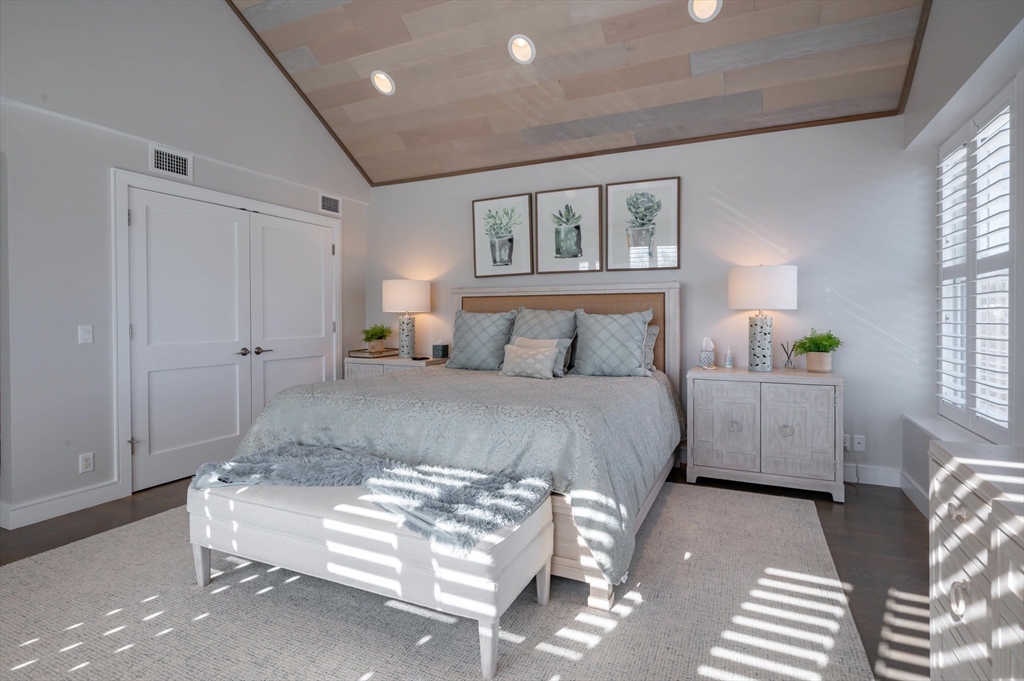 78 Thatcher Road, Unit 6 Gloucester, MA 01930 - Photo 18 of 41 a bedroom with a bed and a night stand