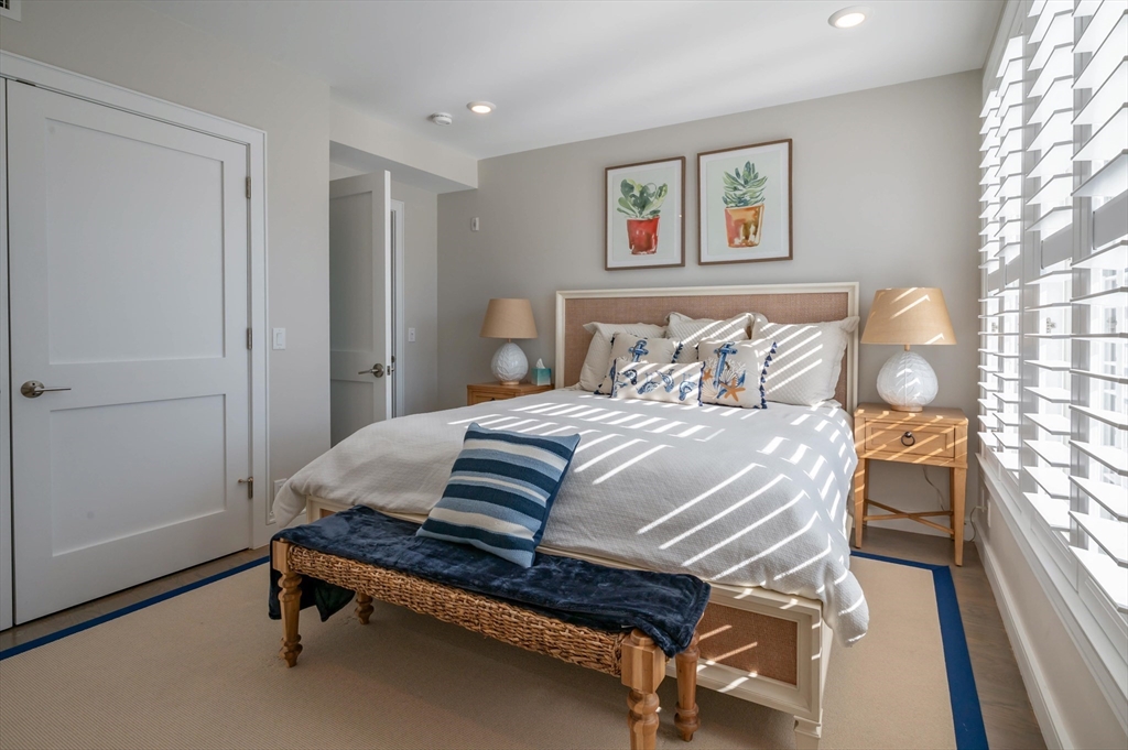 78 Thatcher Road, Unit 6 Gloucester, MA 01930 - Photo 21 of 41 a bedroom with a bed and a window