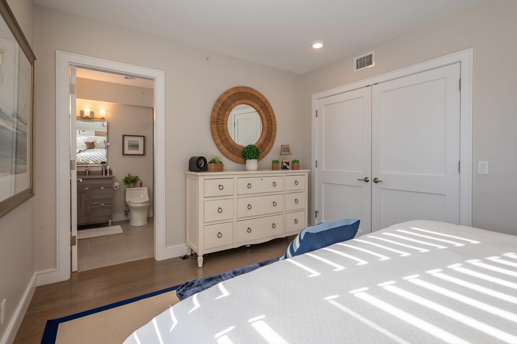 78 Thatcher Road, Unit 6 Gloucester, MA 01930 - Photo 22 of 41 a bedroom with a bed and a dresser