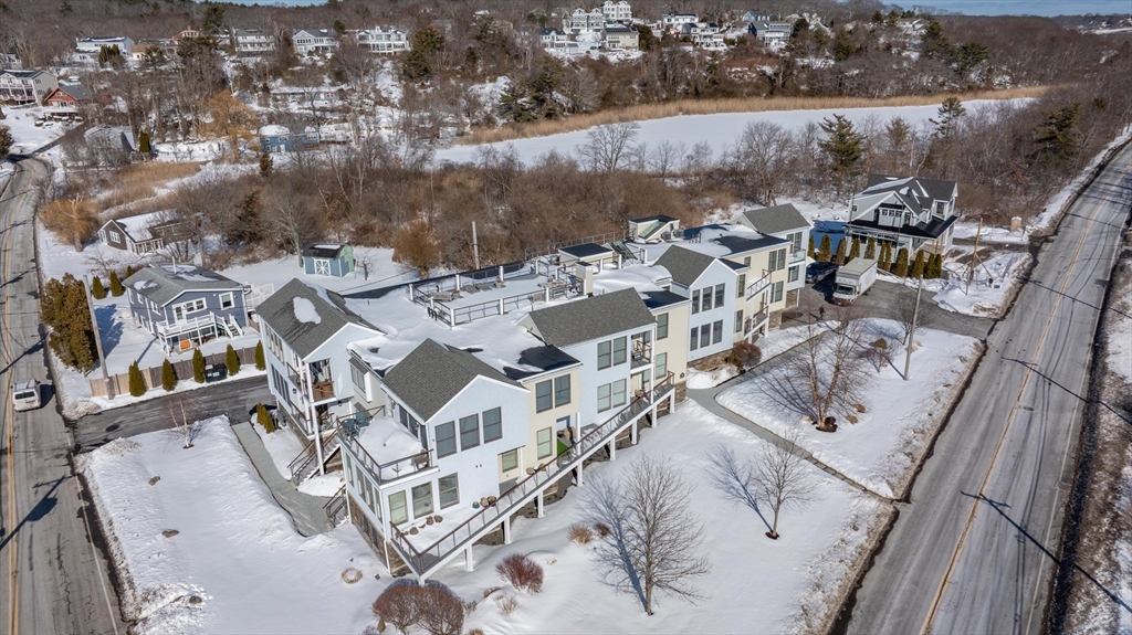 78 Thatcher Road, Unit 6 Gloucester, MA 01930 - Photo 28 of 41 an aerial view of a residential houses with outdoor space