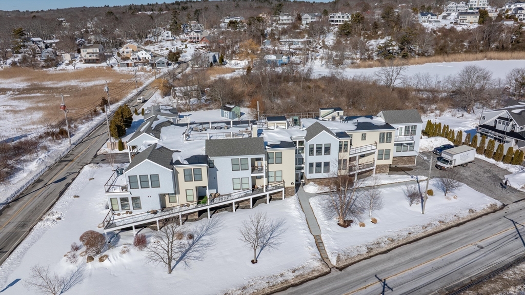 78 Thatcher Road, Unit 6 Gloucester, MA 01930 - Photo 31 of 41 an aerial view of a house with a swimming pool