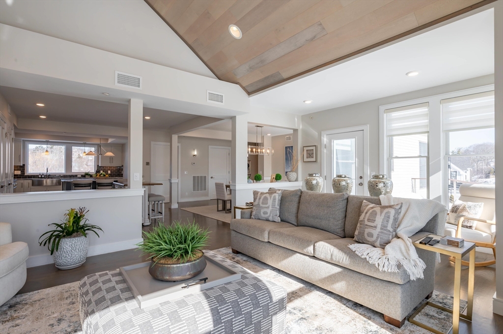 78 Thatcher Road, Unit 6 Gloucester, MA 01930 - Photo 4 of 41 a living room with furniture potted plant and a large window