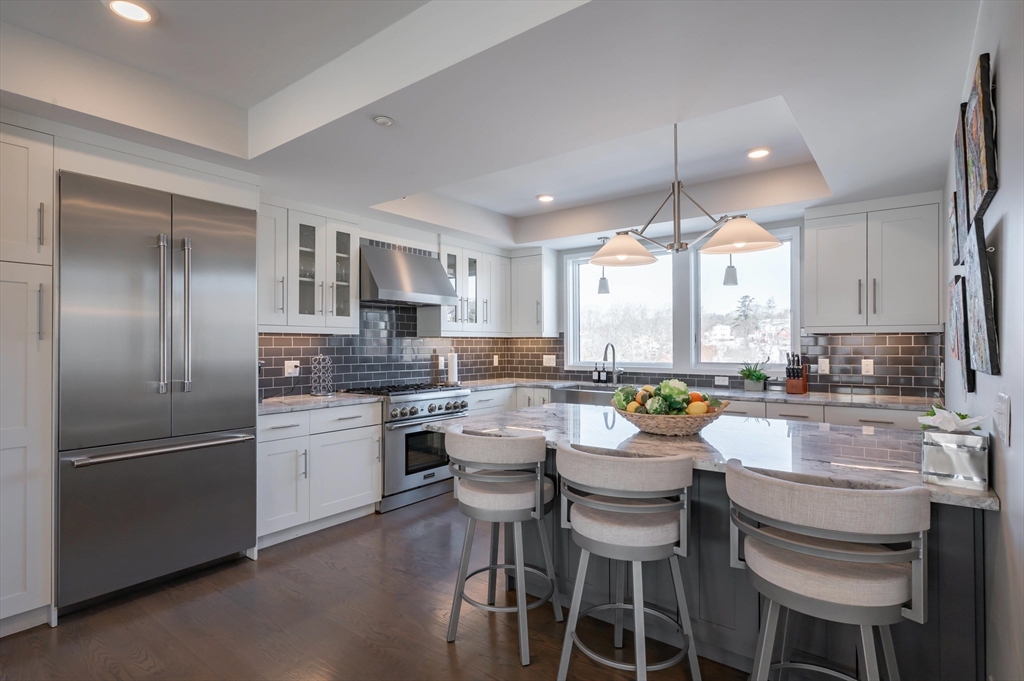 78 Thatcher Road, Unit 6 Gloucester, MA 01930 - Photo 7 of 41 a kitchen with a window and stainless steel appliances