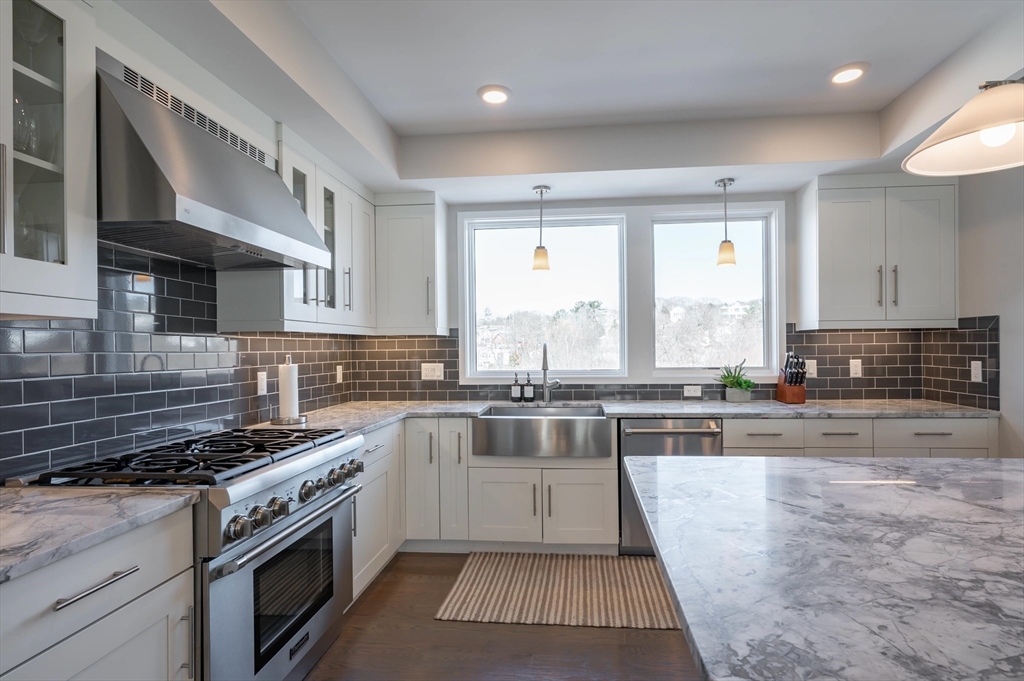 78 Thatcher Road, Unit 6 Gloucester, MA 01930 - Photo 8 of 41 a kitchen with stainless steel appliances granite countertop a stove a sink and a granite counter tops