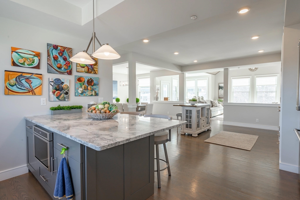 78 Thatcher Road, Unit 6 Gloucester, MA 01930 - Photo 10 of 41 a kitchen with stainless steel appliances granite countertop a stove and a refrigerator