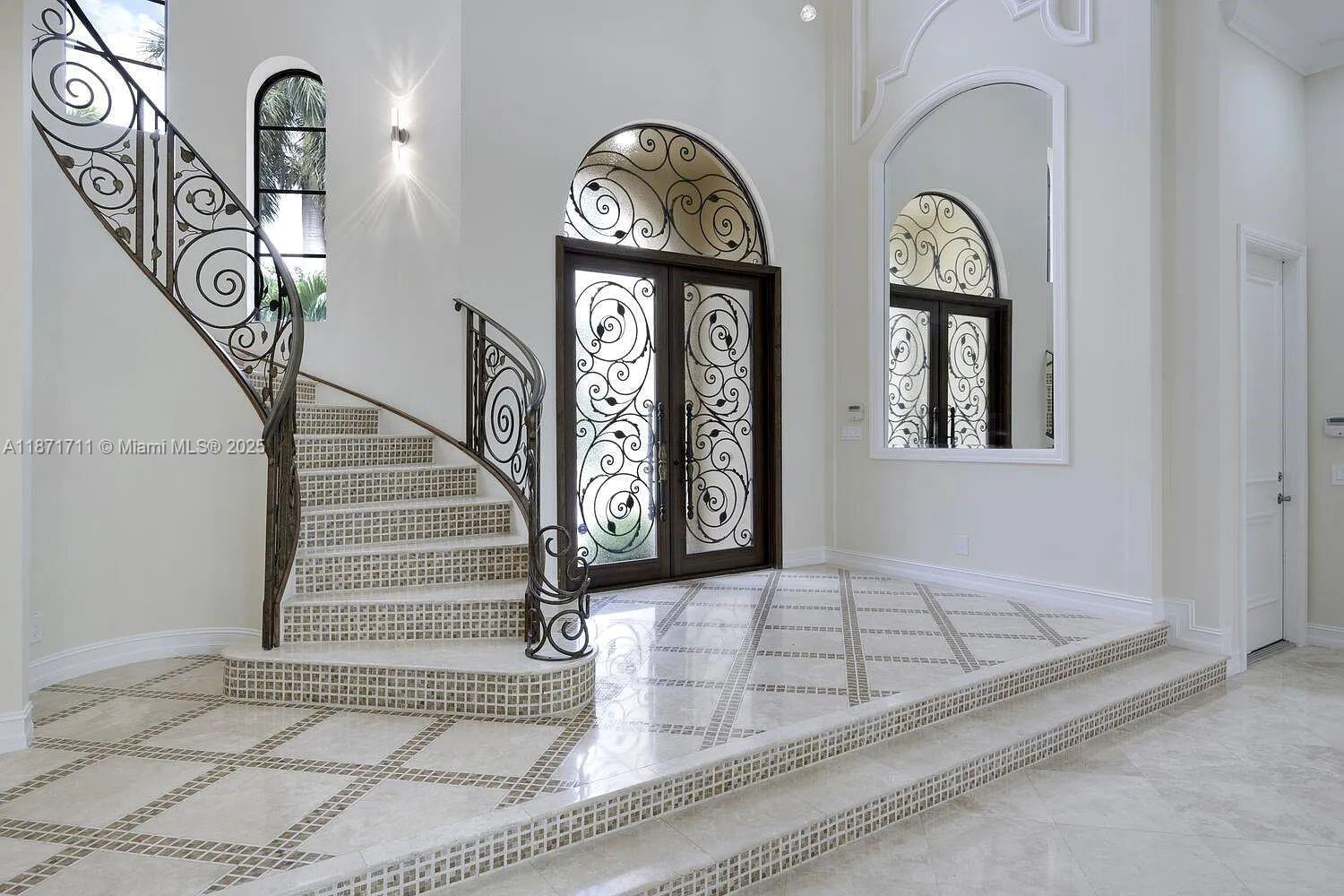 17838 Monte Vista Drive Boca Raton, FL 33496 - Photo 11 of 66 a view of a entryway door with wooden floor