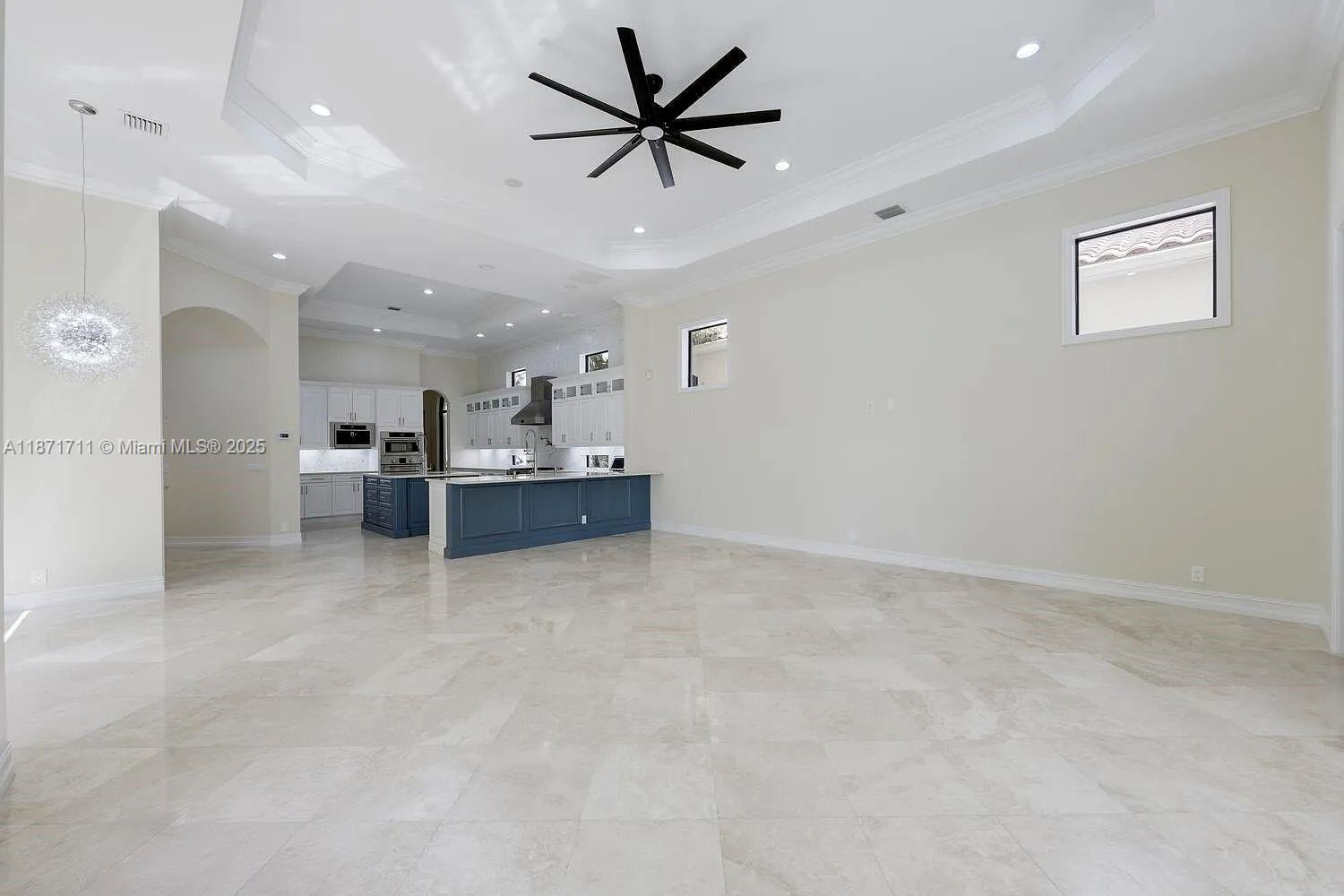 17838 Monte Vista Drive Boca Raton, FL 33496 - Photo 18 of 66 a view of kitchen with furniture and a ceiling fan
